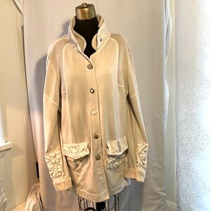 Unique jacket in lt beige with cream accents and antique style embellishments.